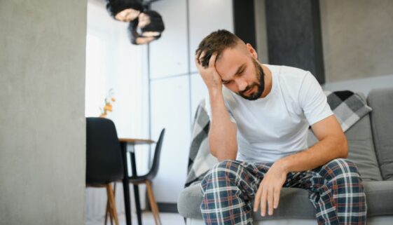 relevate-ketafusion-depression-in-men-stigma-man-on-couch-sad-824x471