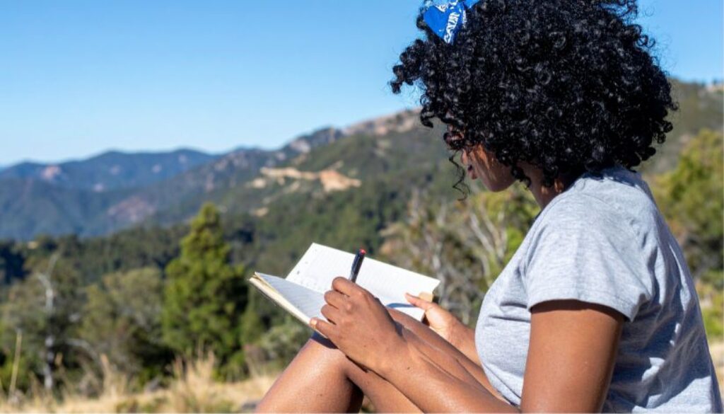 relevate-ketafusion-role-of-integration-after-ketamine-sessions-woman-writing-journal-in-nature-824x471