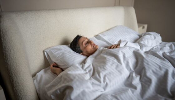 relevate-ketafusion-understanding-dissociation-woman-laying-in-bed-staring-off-824x471